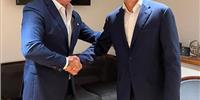 Ioakeim Tsanis, CEO of Hellenic Radio Services and Erik Ceuppens, CEO Marlink Group, shake hands on Marlink's acquisition of the satellite communications business of Hellenic Radio Services. - Credit: Marlink