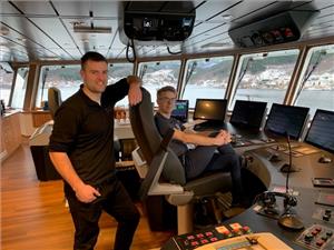 Norsk Fisketransport’s new wellboat Reisa is the first vessel in the world to boast Norwegian Electric Systems’ fully integrated bridge system Raven INS. From left, chief officer Alexander Mathisen and Skipper Sindre Waagø. Photo: Børge Lorentzen, NFT.